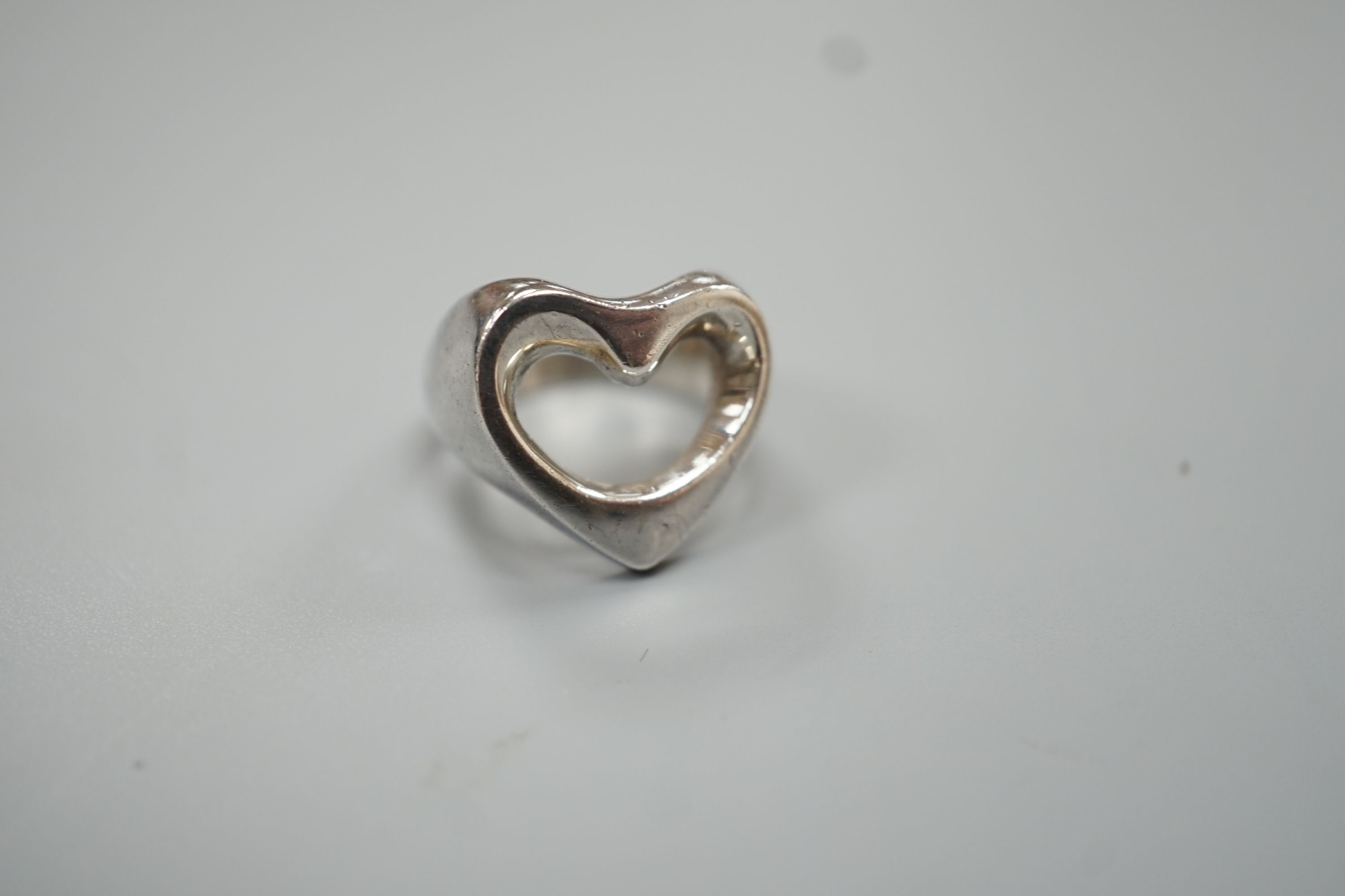 A Georg Jensen sterling pierced heart shaped ring, size M/N, 9.9 grams.